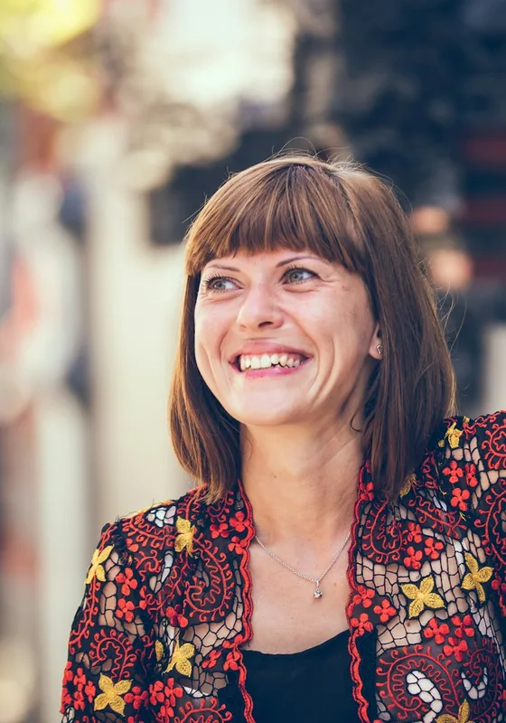 Woman laughing on a street